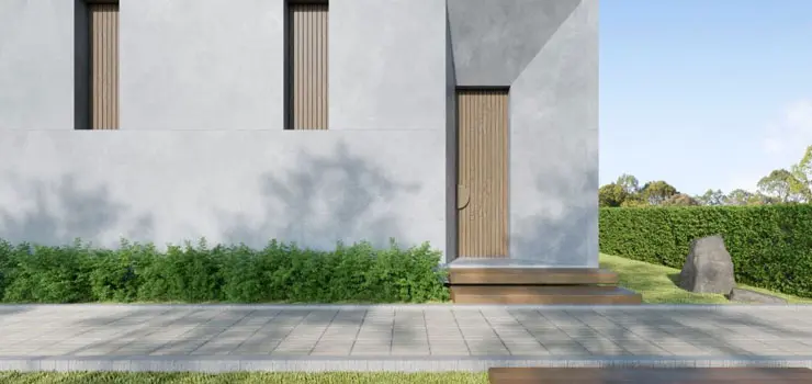 Fachada de casa moderna de un piso hecha con concreto